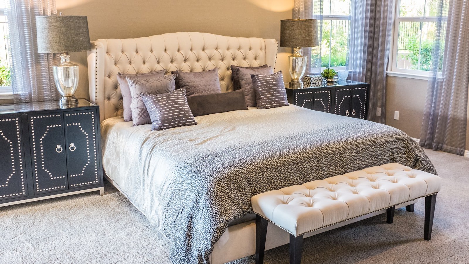 Bright bedroom with morning light on a made bed